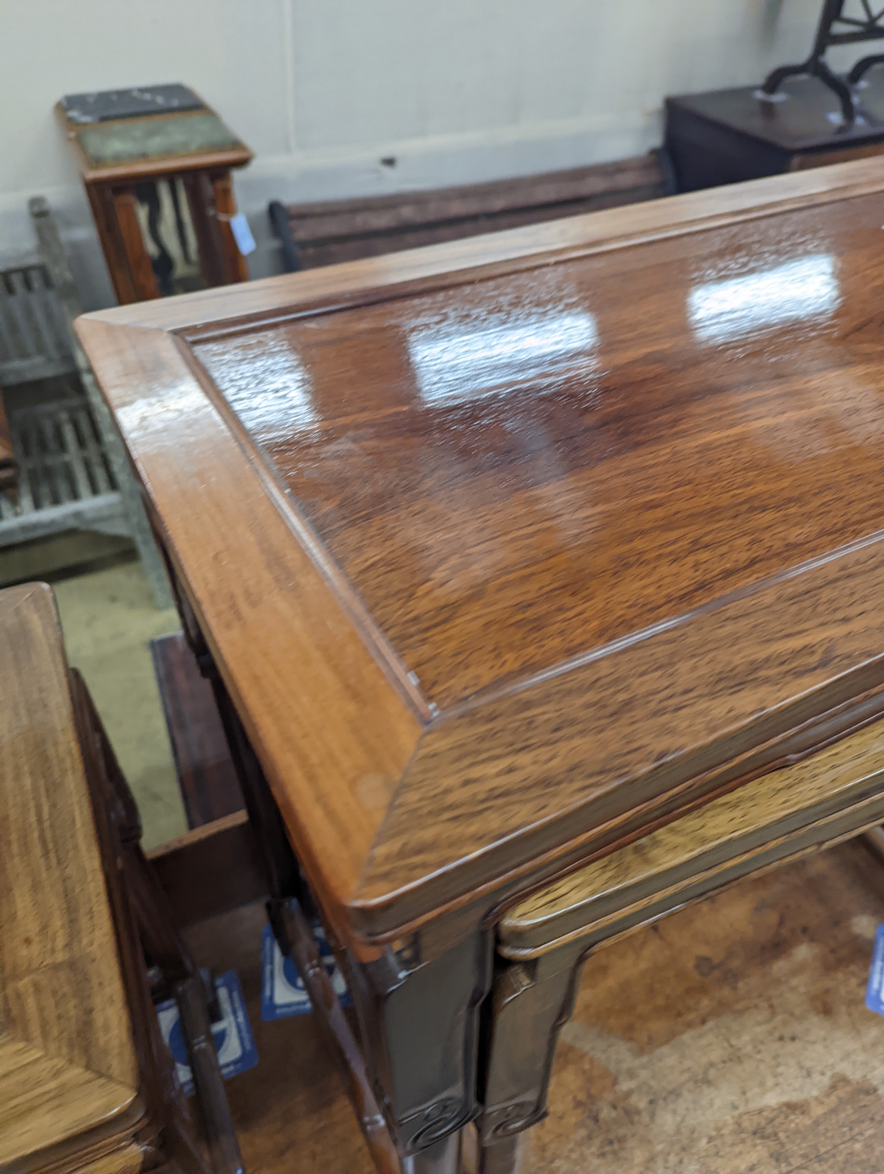 A nest of three Chinese rectangular tea tables, width 61cm, depth 36cm, height 66cm